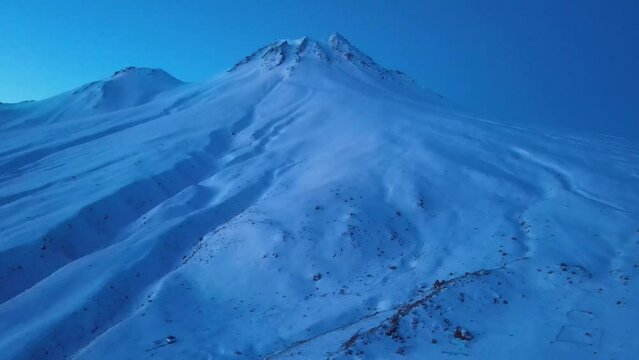 The scenic views of Hasan Mountain, which is a volcanic mountain with its 3268 meters peak, attracts the summit lovers with its majestic stance during sunrise hours, Aksaray, Turkey
