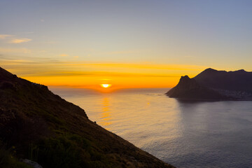 Hout Bay coastal mountain landscape at sunset in Cape Town.