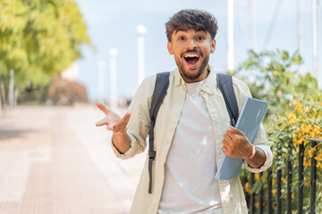 Young student Arabian man at outdoors with shocked facial expression