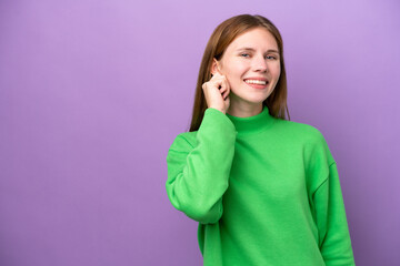 Young English woman isolated on purple background laughing