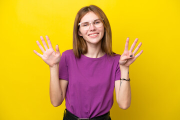 Young English woman isolated on yellow background counting nine with fingers