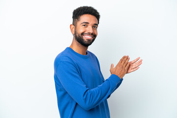 Young Brazilian man isolated on white background applauding