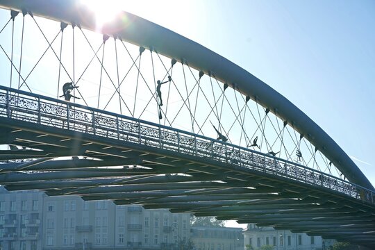 Poland. Krakow. Artistic Bridge with Sculpted Figures in the Sunlight. J zef Pi sudski Bridge. Bridge Circus