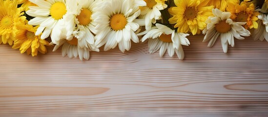 Beautiful yellow chrysanthemums and large white decorative daisies are meticulously arranged on a rustic wooden table in a sunny outdoor setting