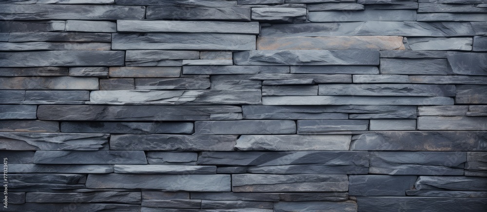 Poster Detailed close-up showcasing the texture of a slate wall against a deep black background, perfect for design projects