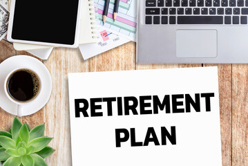 Business quotes, RETIREMENT PLAN on notebook or paper in office desk, office workplace