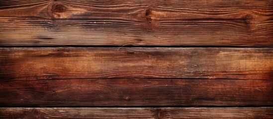 Fototapeta premium Detailed close-up of a wooden wall featuring a rich brown stain, creating a warm and rustic texture for backgrounds or design projects