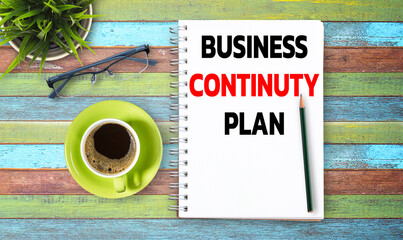 Business quotes, BUSINESS CONTINUTY PLAN on notebook or paper in office desk, office workplace,...