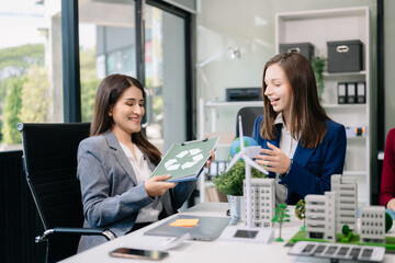 business team people planning and discussing on recycle reduce reuse policy symbol in office meeting room. Green business company and Solar Energy Environment city