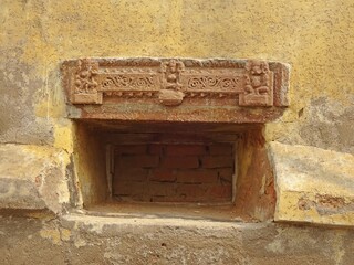 Carved palace exterior wall showcasing intricate designs and patterns, RAMNAGAR FORT, VARANASI,...