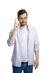 Man in a white shirt and jeans pointing up, with glasses, on a white background, indicating an idea...