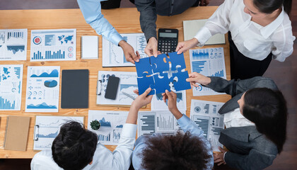 Panorama top view diverse corporate officer worker collaborate in office connect puzzle piece as partnership and teamwork concept. Unity and synergy in business success with jigsaw puzzle. Concord - obrazy, fototapety, plakaty