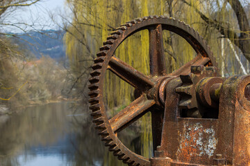 old mechanical metal gears mechanism on the abandoned dam