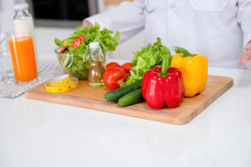 Young woman embraces joyful moments in kitchen.
