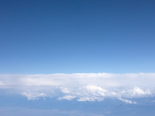 Background view of blue sky and white clouds from an aerial view
