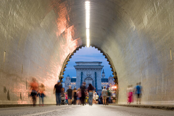 Tunnel, blurred people walking