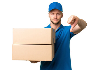Delivery caucasian man over isolated background showing thumb down with negative expression