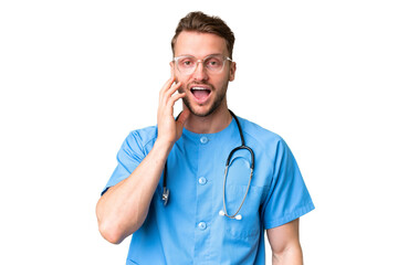 Young nurse man over isolated chroma key background with surprise and shocked facial expression - 771361033