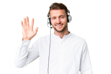 Telemarketer caucasian man working with a headset over isolated chroma key background saluting with hand with happy expression