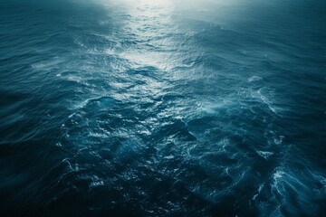 Fototapeta premium Aerial view of the ocean's vastness, contrasting the deep blue with the shores.