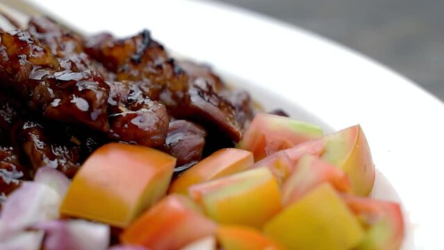 Stock video of goat satay that has been arranged, from left to right