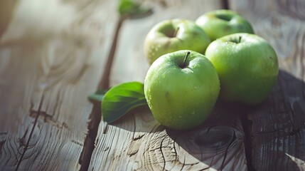 Close up of fresh Green Apples on a rustic wooden Table