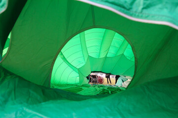 inside view of a green hot air balloon during setup