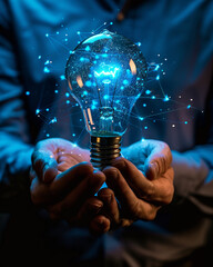 Businessman holding blue glowing Brain lightbulb. Creative thinking and problem solving concept. - obrazy, fototapety, plakaty