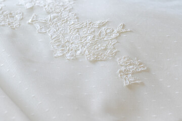 delicate bridal fabric with embroidered lace detail