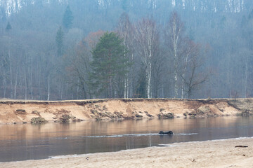 A beautiful early spring landscape with a river. Natural rural scenery of Northern Europe.