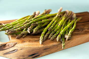 asparagus on a wooden board.
