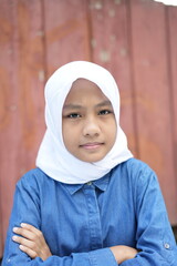 Portrait of an Asian girl wearing a white hijab