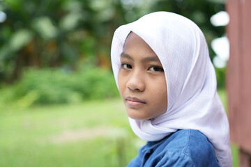 Portrait of an Asian girl wearing a white hijab