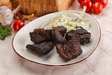 Grilled beef barbecue served onion