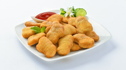 Chicken Nuggets. A chicken nugget is a food product consisting of a small piece of deboned chicken meat that is breaded or battered, then deep-fried or baked.