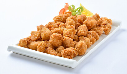 Pop Corn Chicken. Pop Corn chicken is a Snack food product consisting of a small pieces of deboned chicken meat that is breaded or battered, then deep-fried or baked.