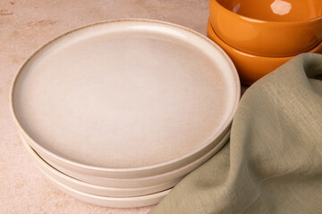A selection of tableware on a brown stone tabletop.