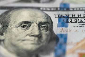 One hundred dollars banknotes background, close-up. 100 US dollar money bill with president face....