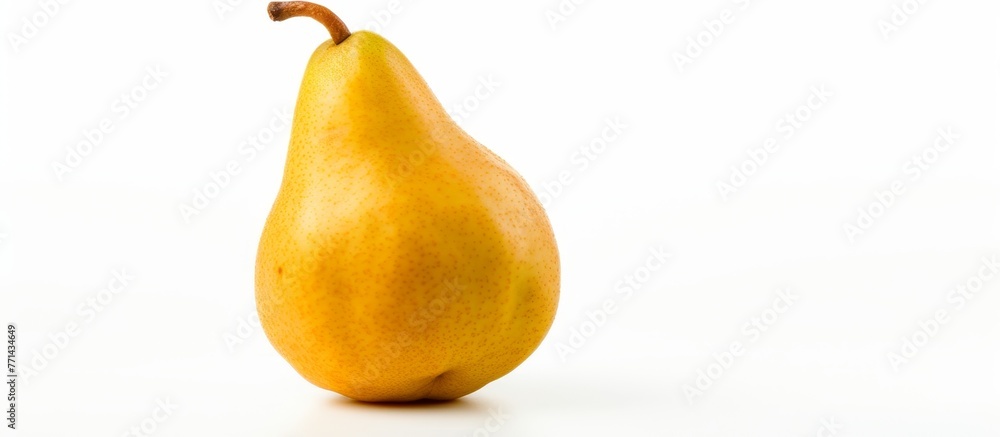 Poster a single yellow pear, a natural fruit, is placed on a white surface. pear is a staple food ingredien