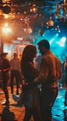 Stylish and beautiful young romantic lovely couple dancing in nightclub, motion blur selective focus reportage flash photography style. Sparkles and glimmers for glamour and excitement atmosphere.