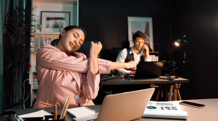 Smart businesswoman having aches with body in back, neck and whole body, stretching composition in...