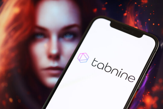 KYIV, UKRAINE - MARCH 17, 2024 Tabnine logo on iPhone display screen with background of artificial intelligence futuristic ai generated image close up