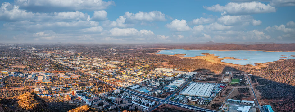 Fototapeta aerial view of gaborone capital city of Botswana, gaborone dam industrial and residential neighborhood late afternoon, high altitude