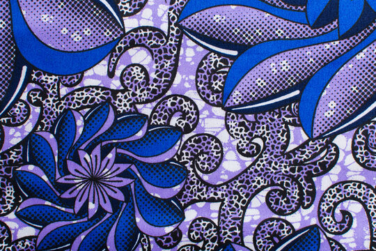 top view of purple blue ankara fabric, flatlay of nigerian wax cloth with designs, spread out purple blue ankara material