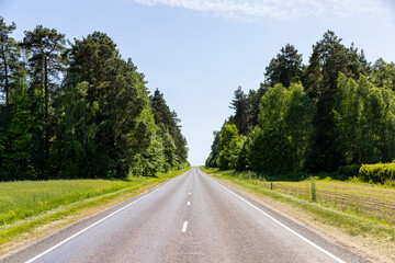 Fototapeta premium paved road with white line markings