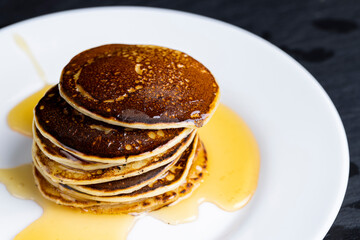 delicious homemade hot pancakes with honey