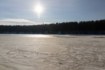 the ice-covered surface of the river in the winter season