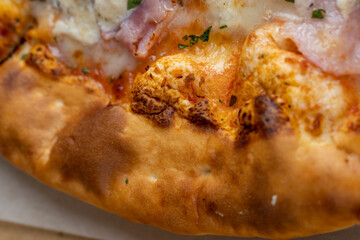 a slice of pizza with mushrooms and meat in sauce