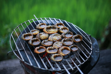 a Lots of Ricefield crabs on the charcoal grill. Simple food in the rice fields Farmers live a simple life.