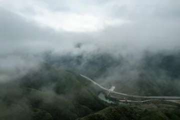 Zelfklevend Fotobehang Huangshan Aerial Shot Mount Huangshan Forest Winding Mountain Road Anhui